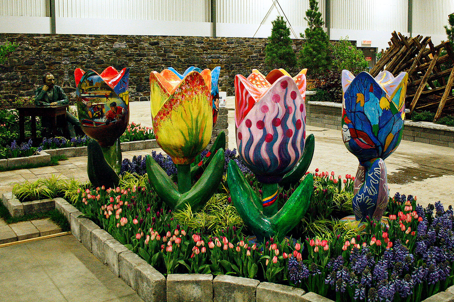 giant tulip sculptures in a garden display